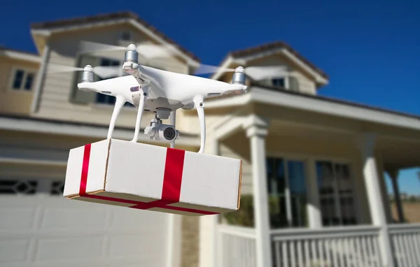 Unmanned Aircraft System Uav Quadcopter Drone Delivering Box Red Ribbon — Stock Photo, Image