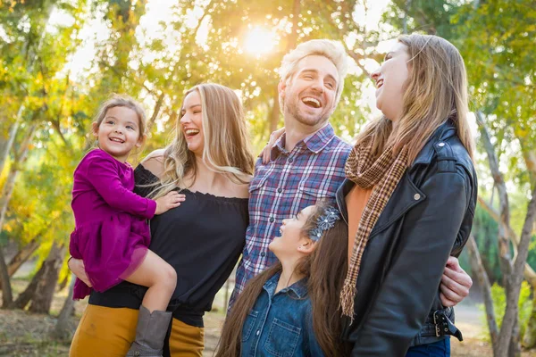 Mixed Race Family Members Having Fun Outdoors.