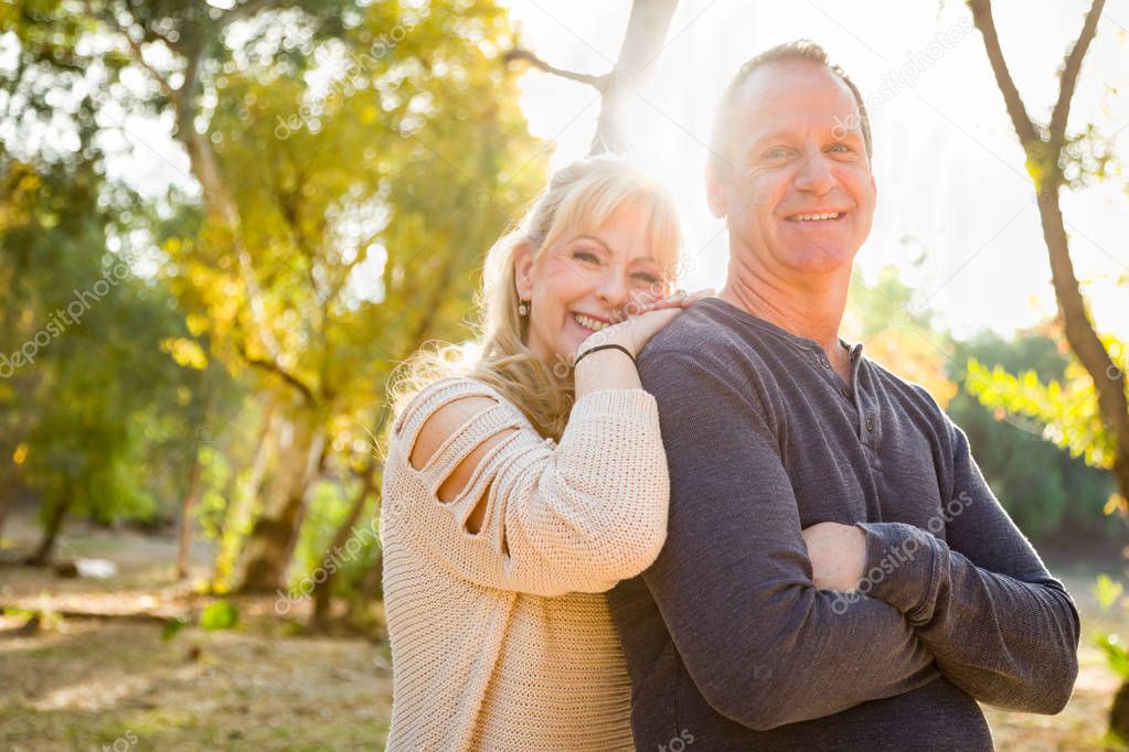 Happy Middle Aged Caucasian Couple Portrait Outdoors.