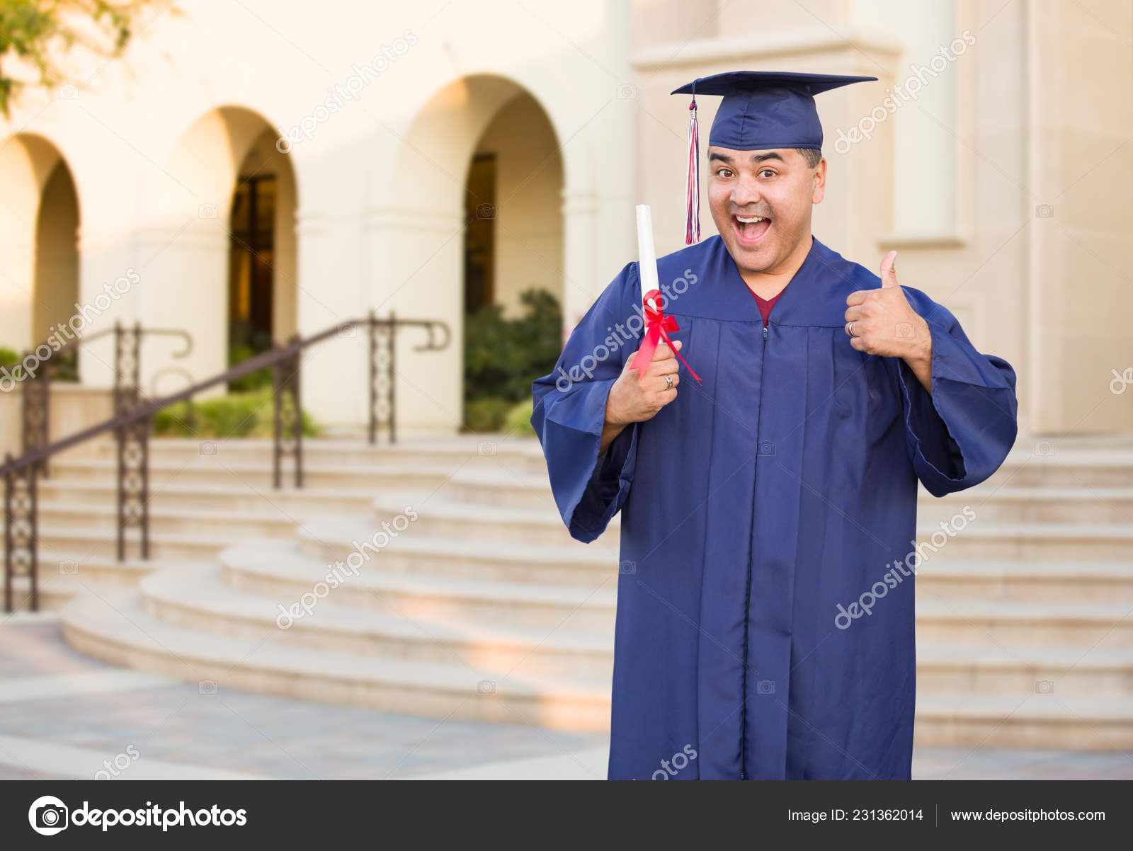 man wearing black graduation cap with yellow tassel and black graduation  gown with white sash by Nodar Chernishev. Photo stock - StudioNow