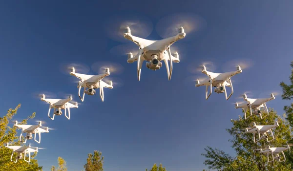 Formation of Drones Swarm in the Blue Sky.