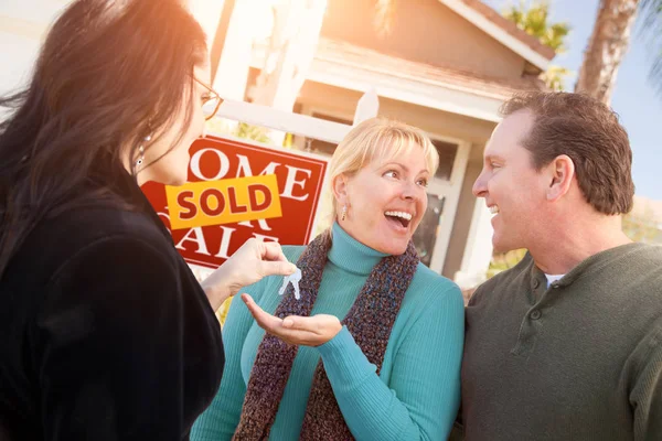 Hispanic Female Real Estate Agent Handing New House Keys Happy Stock Picture