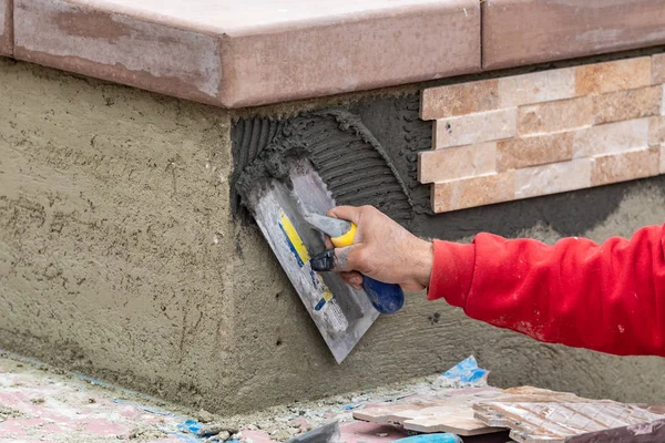 Worker Installing Wall Tile Cement with Trowel and Tile at Const — Stock Photo, Image