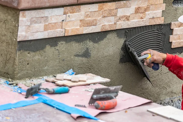 Worker Installing Wall Tile Cement with Trowel and Tile at Const — Stock Photo, Image