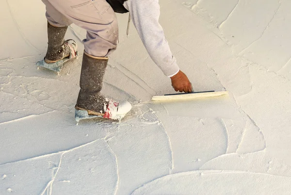 Worker Wearing Spiked Shoes Smoothing Wet Pool Plaster With Trow — Stock Photo, Image