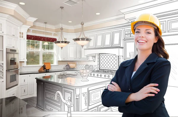 Usměvavý ženský dodavatel nad kuchyňským kreslením na fotografii — Stock fotografie