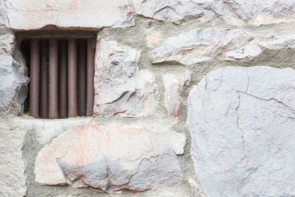 Old Stone Wall With Small Iron Barred Prison Cell Window — Stock Photo, Image