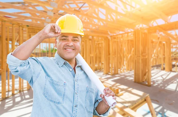 Hispanic Male Contractor with Blueprint Plans Wearing Hard Hat At Construction Site. — Stock Photo, Image