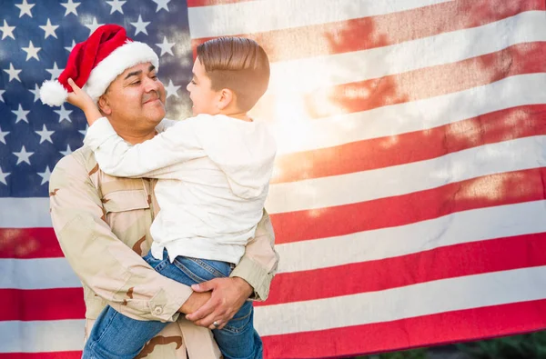 Hispanic Male Soldier Wearing Santa Cap Holding Mixed Race Son — Stock Photo, Image