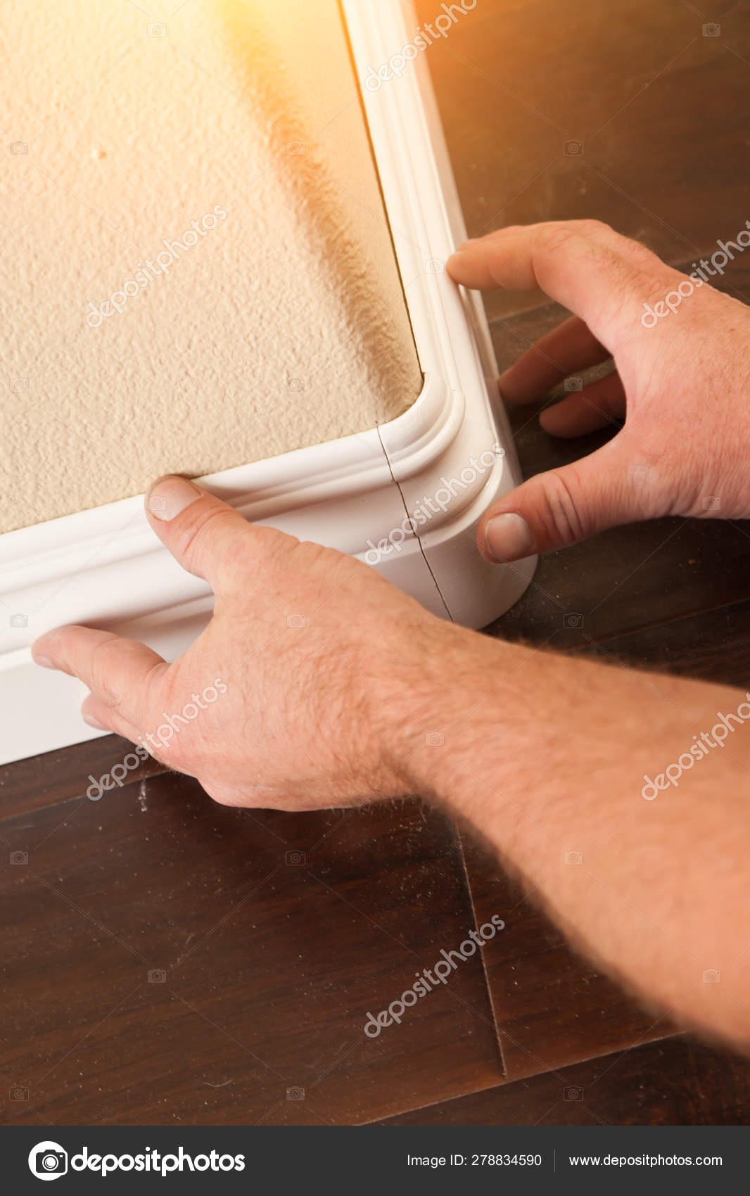 Contractor Installing New Baseboard With Bull Nose Corners And New