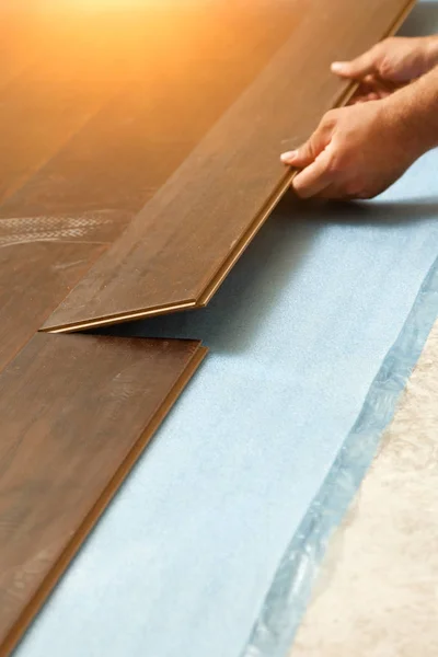 Man Installing New Laminate Wood Flooring Abstract. — Stock Photo, Image
