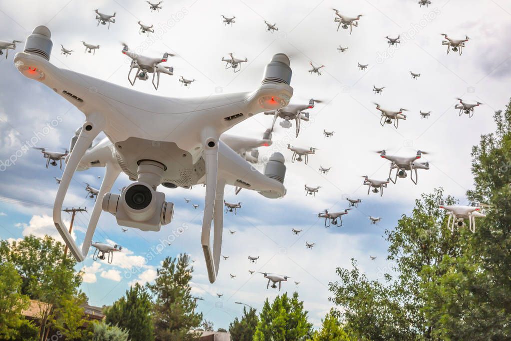 Dozens of Drones Swarm in the Cloudy Sky