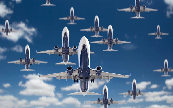 Bottom View of Several Passenger Airplanes Flying In The Blue Sk — Stock Photo, Image