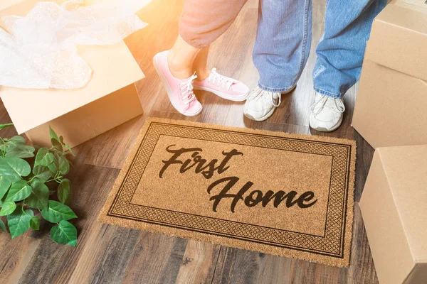 Man and Woman Unpacking Near First Home Welcome Mat, Moving Boxes and Plant — Stock Photo, Image