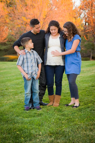 Hispanic Pregnant Family Portrait Against Fall Colored Trees — Stock Photo, Image