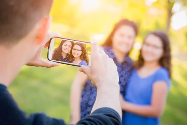 Hispanic Father Taking Picture of Mother and Daughter with Cell Phone — Stock Photo, Image