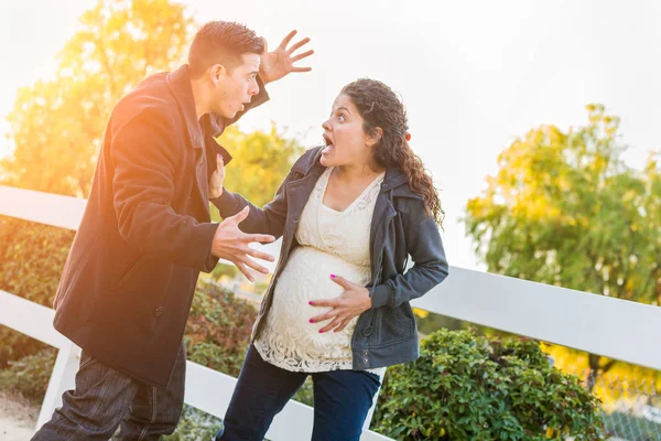 Stunned Hispanic Pregnant Young Couple In Pain Walking Outdoors — Stock Photo, Image