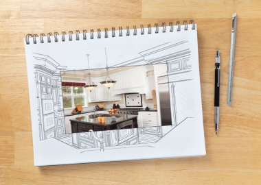 Sketch Pad on Desk with Drawing of Custom Kitchen and Square Section Showing Finished Construction Next To Engineering Pencil and Ruler Scale.