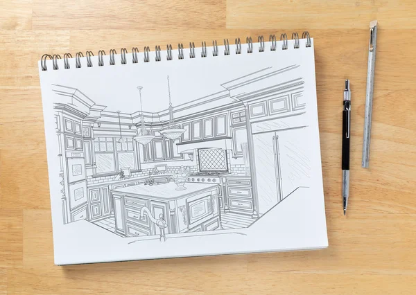 Skizzenblock auf der Arbeitsplatte mit Zeichnung der kundenspezifischen Kücheneinrichtung neben Bleistift und Lineal. — Stockfoto