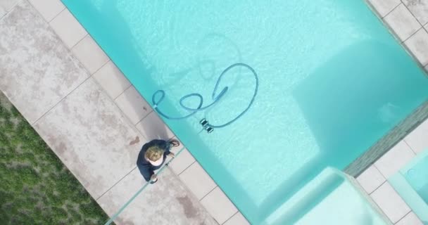 Overhead Aerial Woman Vacuuming Swimming Pool — Stockvideo
