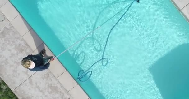 Overhead Aerial Woman Vacuuming Swimming Pool — Wideo stockowe