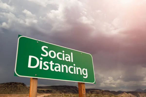 Social Distancing Green Road Sign Ominous Stormy Cloudy Sky — Stock Photo, Image
