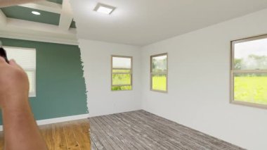 Tamamlanmamış bir evin öncesi ve sonrası için erkek el boya silindiri kullanarak güzelce yenilenmiş bir silindir..