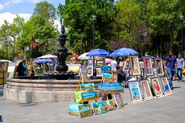 MEXICO CITY,MEXICO - JULY 14,2018 : The famous Saturday Bazaar at the San Angel neighborhood selling paintings and traditional works of art clipart