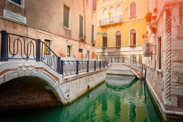 Canal and small bridge in the romantic city of Venice, Italy