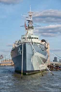 The HMS Belfast warship on the river Thames in London clipart