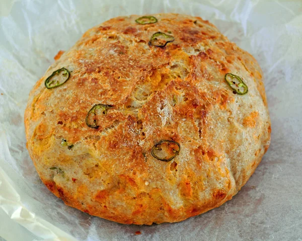 Homemade Rustic Jalapeno Cheddar Bread Parchment Closeup Horizontal Format — Stock Photo, Image