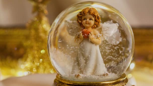 Footage of Christmas snow globe angel decoration for the advent season 