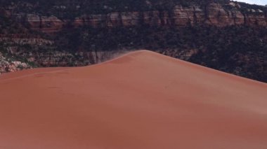 Sun has barely set above Coral Pink Sand Dunes State Park near Kanab, Utah, USA