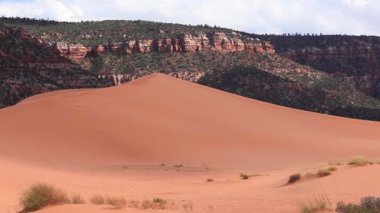 Sun has barely set above Coral Pink Sand Dunes State Park near Kanab, Utah, USA