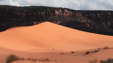 Sun has barely set above Coral Pink Sand Dunes State Park near Kanab, Utah, USA