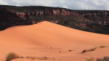 Sun has barely set above Coral Pink Sand Dunes State Park near Kanab, Utah, USA