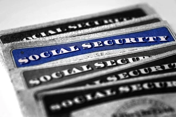 Social Security Cards in a Row Pile for Retirement