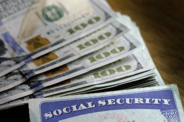 Social Security cards with cash money for savings and retirement clipart