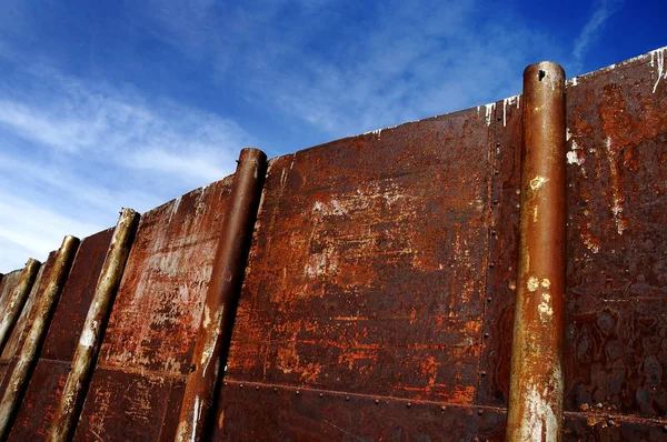 Rusty Old Steel Border Wall for Security High Protection