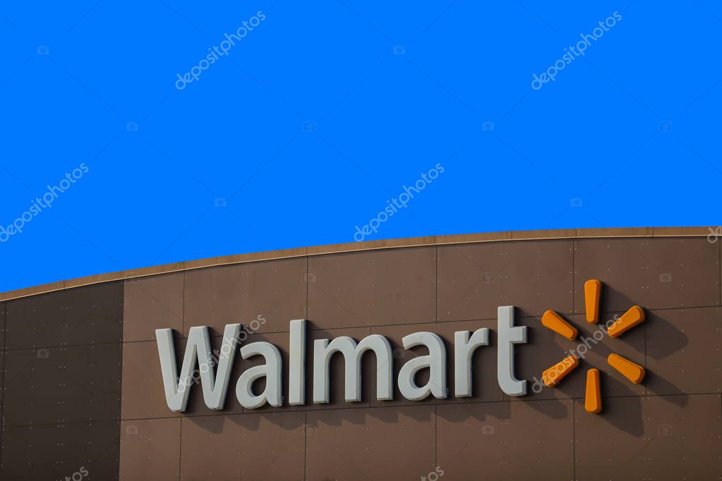 MIAMI, FL, USA - JUNE 9, 2018: Photo of a walmart store sign logo on deep blue sky