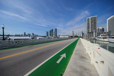 Photo of the Venetian Causeway Miami with green painted bike lanes clipart