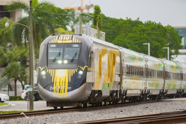 Brightline high speed train departing from Fort Lauderdale FL clipart