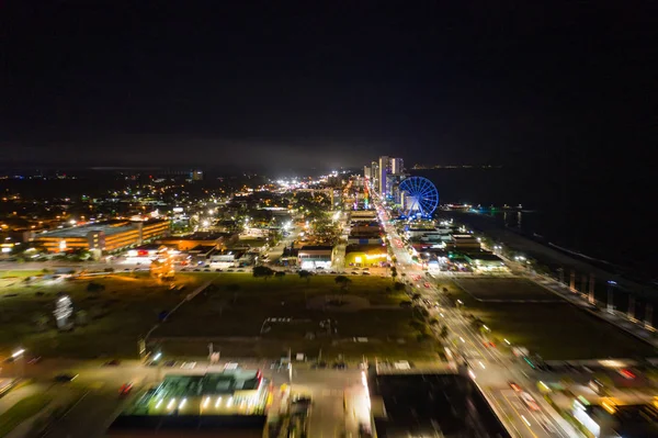 Motion blur flying approach Myrtle Beach at night city lights — Stock Photo, Image