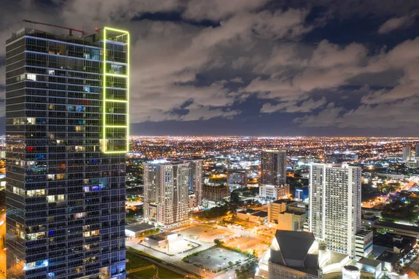 Neon yellow light on a highrise building Downtown Miami FL