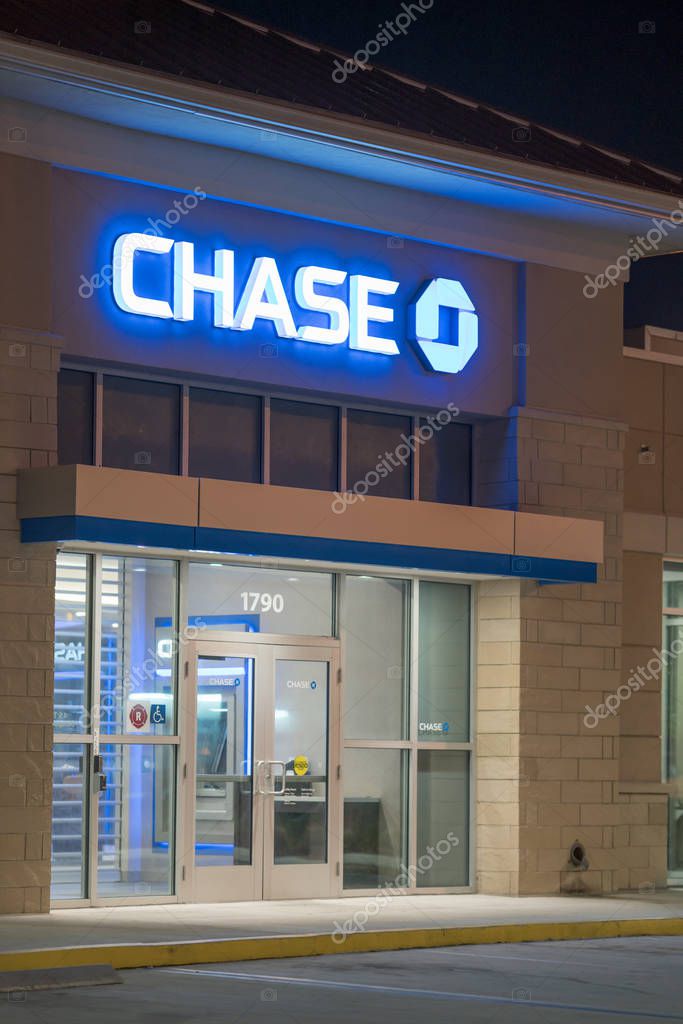 Night photo of Chase Bank Hollywood FL neon blue glowing bank logo