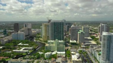 Aerial footage of Icon Las Olas a luxury highrise condominium on the Tarpon River 4k