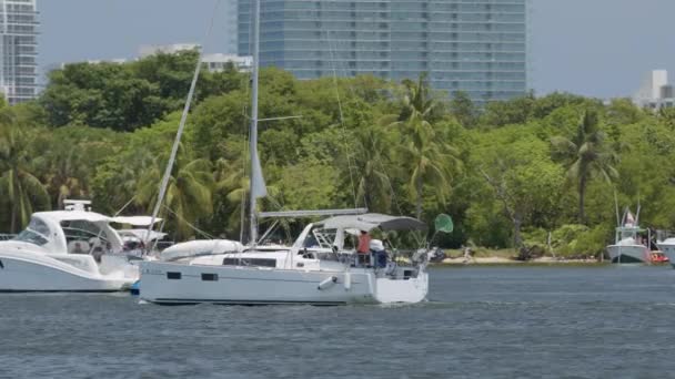 Miami, FL, USA - May 31, 2020: Tracking shot of a sailboat in the water 6k blackmagic raw