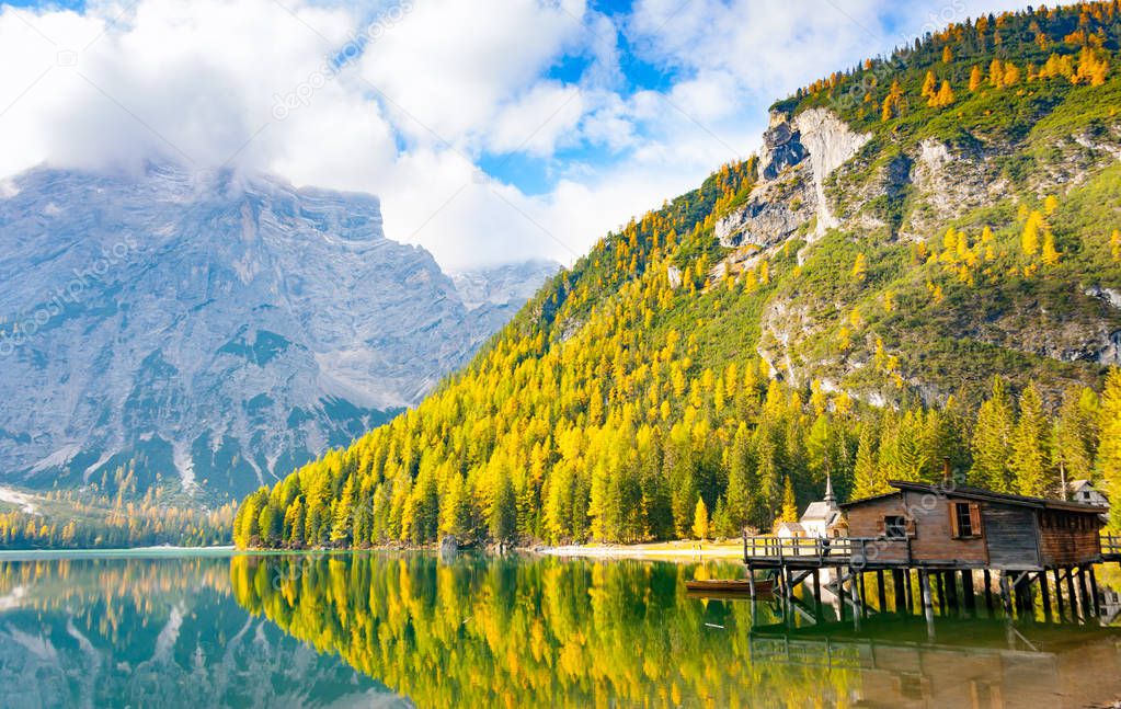 Hut on Prags lake and Dolomites in autumn, Trentino Alto Adige, Italy