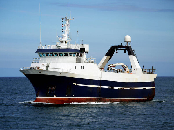 Stern Trawler underway at sea to fishing grounds.