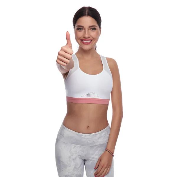 Portrait Smiling Fit Woman Making Thumbs Sign While Standing White — Stock Photo, Image